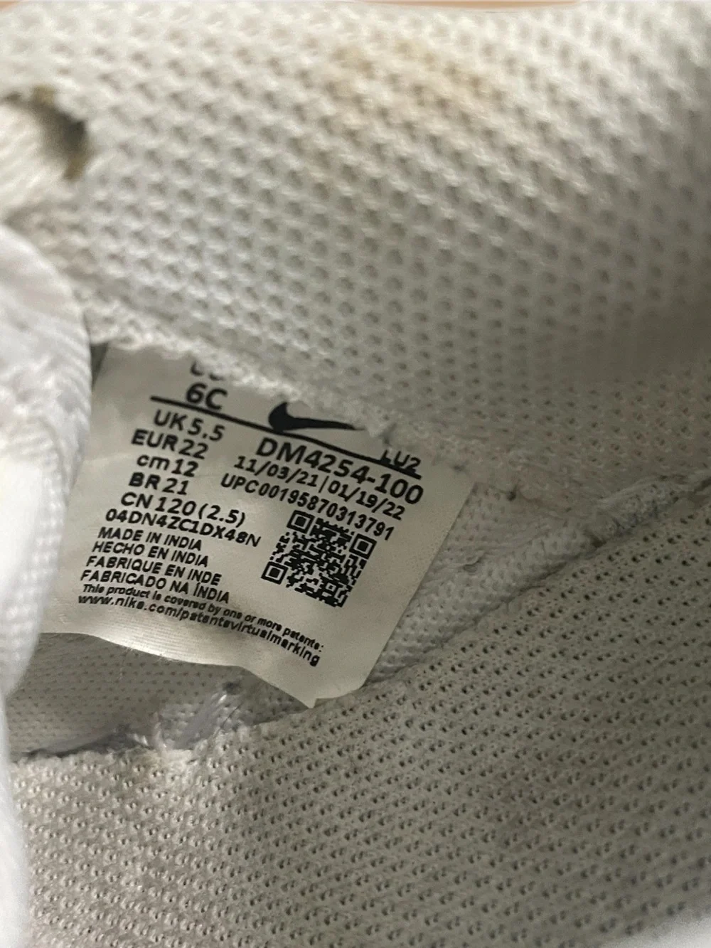 Nike Toddler White Sneakers with Black Swoosh and Yellow Star